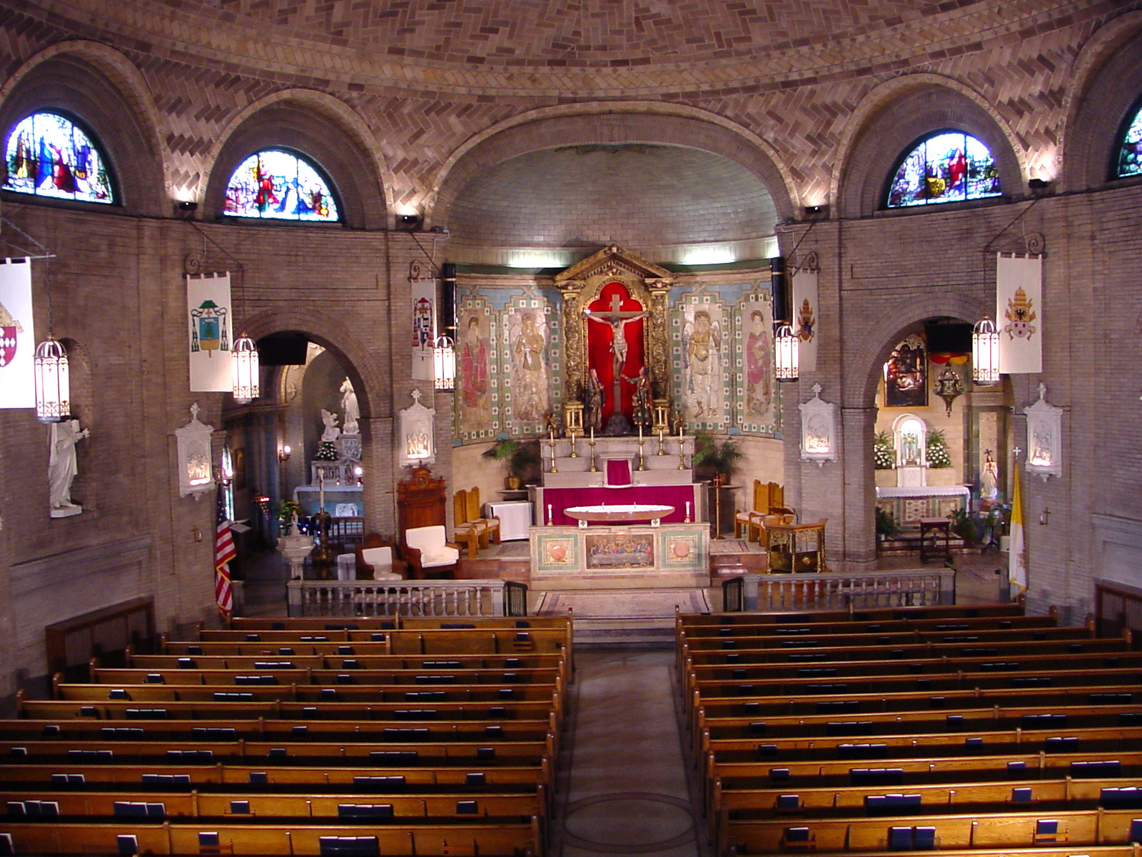 Interior sanctuary of the Basilica of St Lawrence in Asheville, North Carolina with brick arches and altar