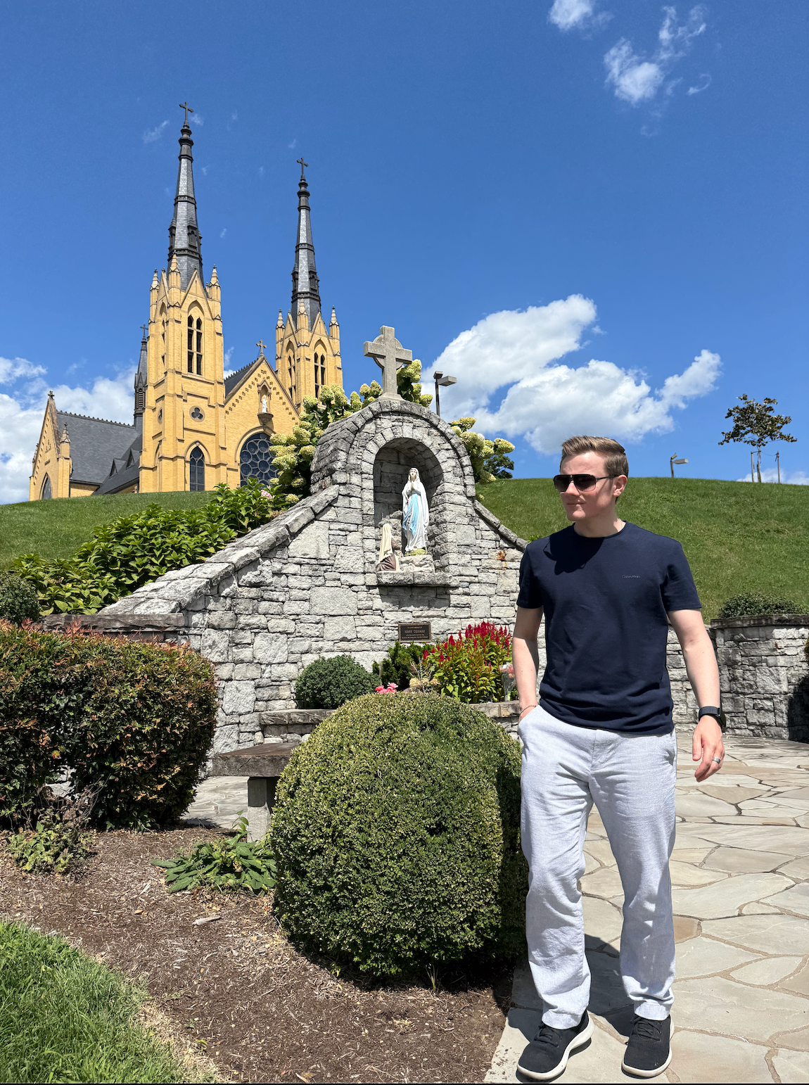 Grady Connolly outside a Marian grotto at a basilica in Roanoke, Virginia