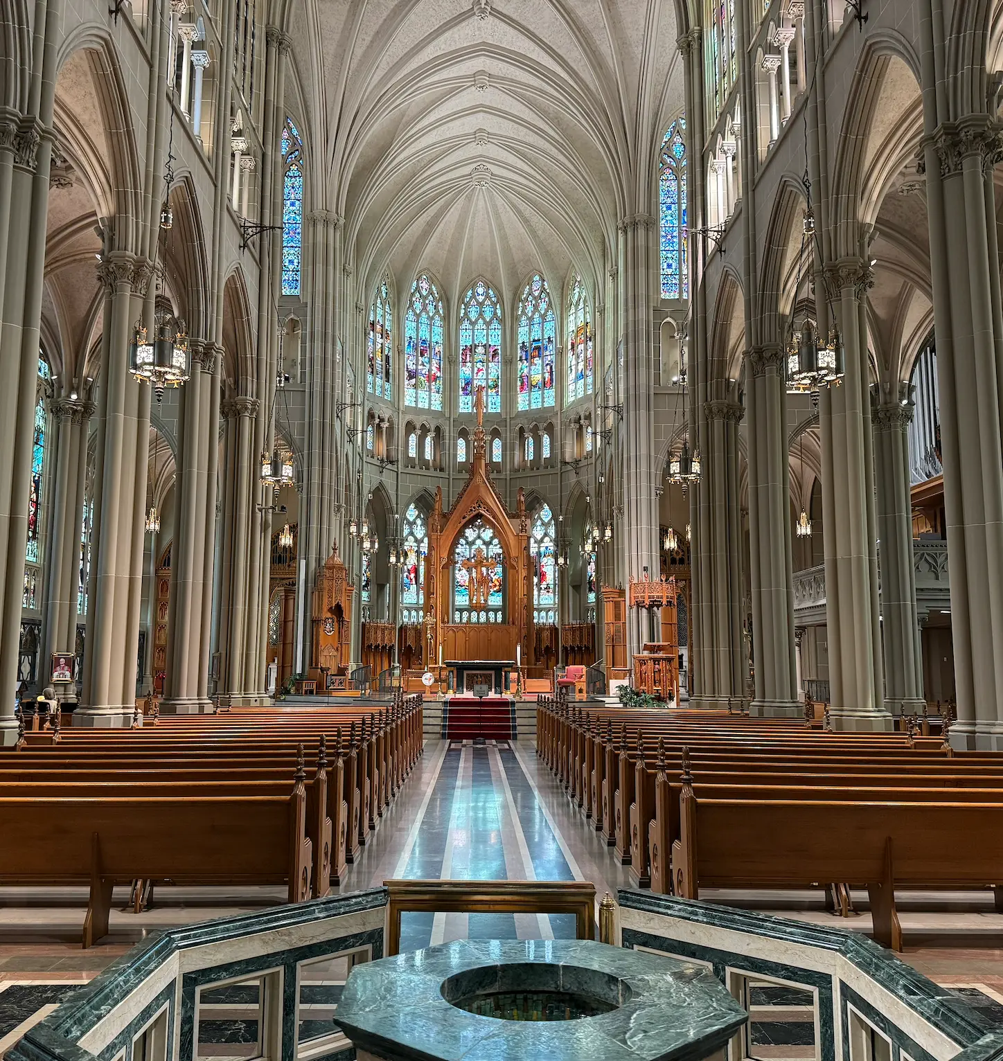 Interior nave and stained glass windows of the Cathedral Basilica of the Assumption in Covington, Kentucky