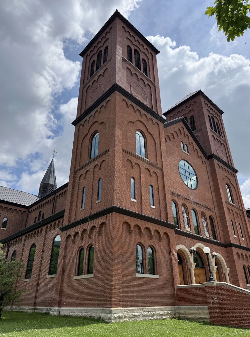 Exterior brick towers and facade of the Basilica of the Immaculate Conception at Conception Abbey in Nodaway County, Missouri