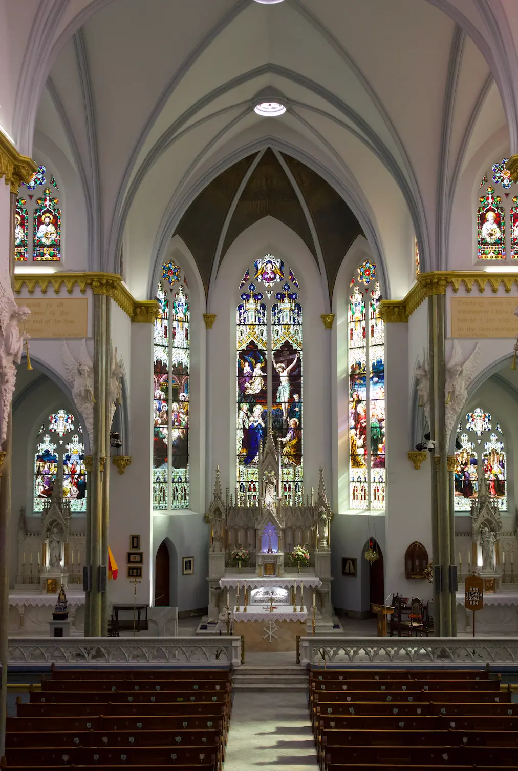 Interior sanctuary and stained glass windows of the Basilica of the Immaculate Conception in Jacksonville, Florida